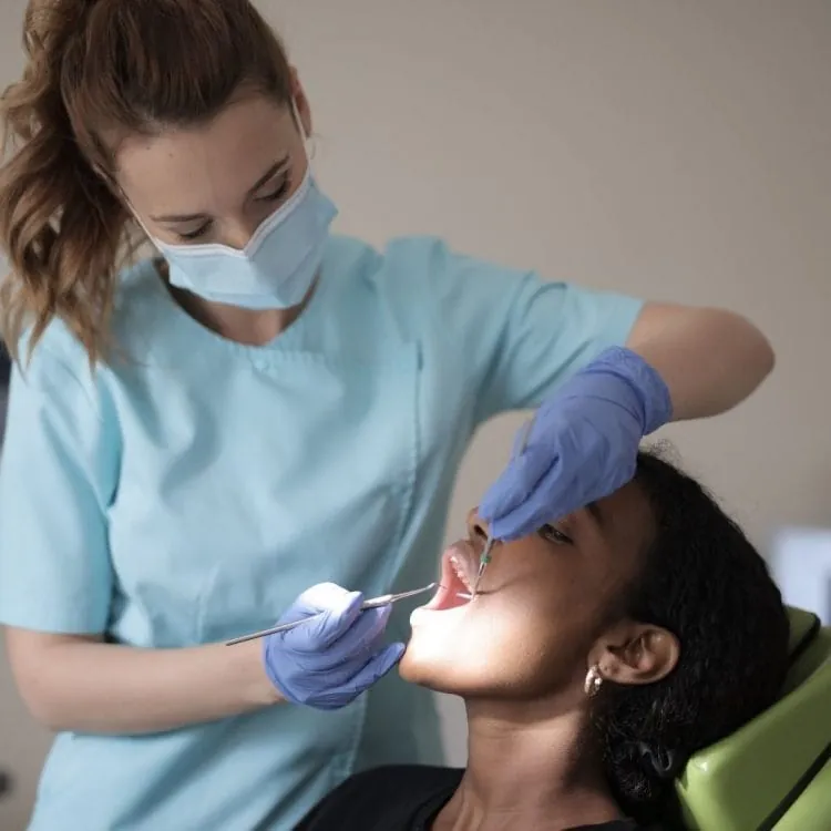 Clinical examination of the gums with gloved hands