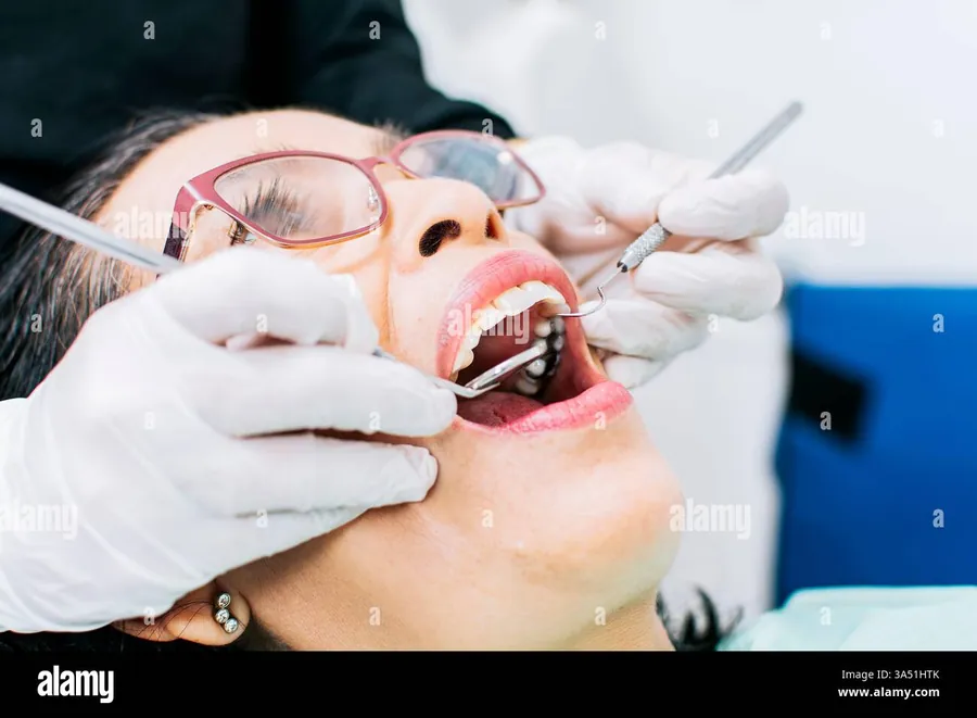 Dentist examining a patient during gum assessment